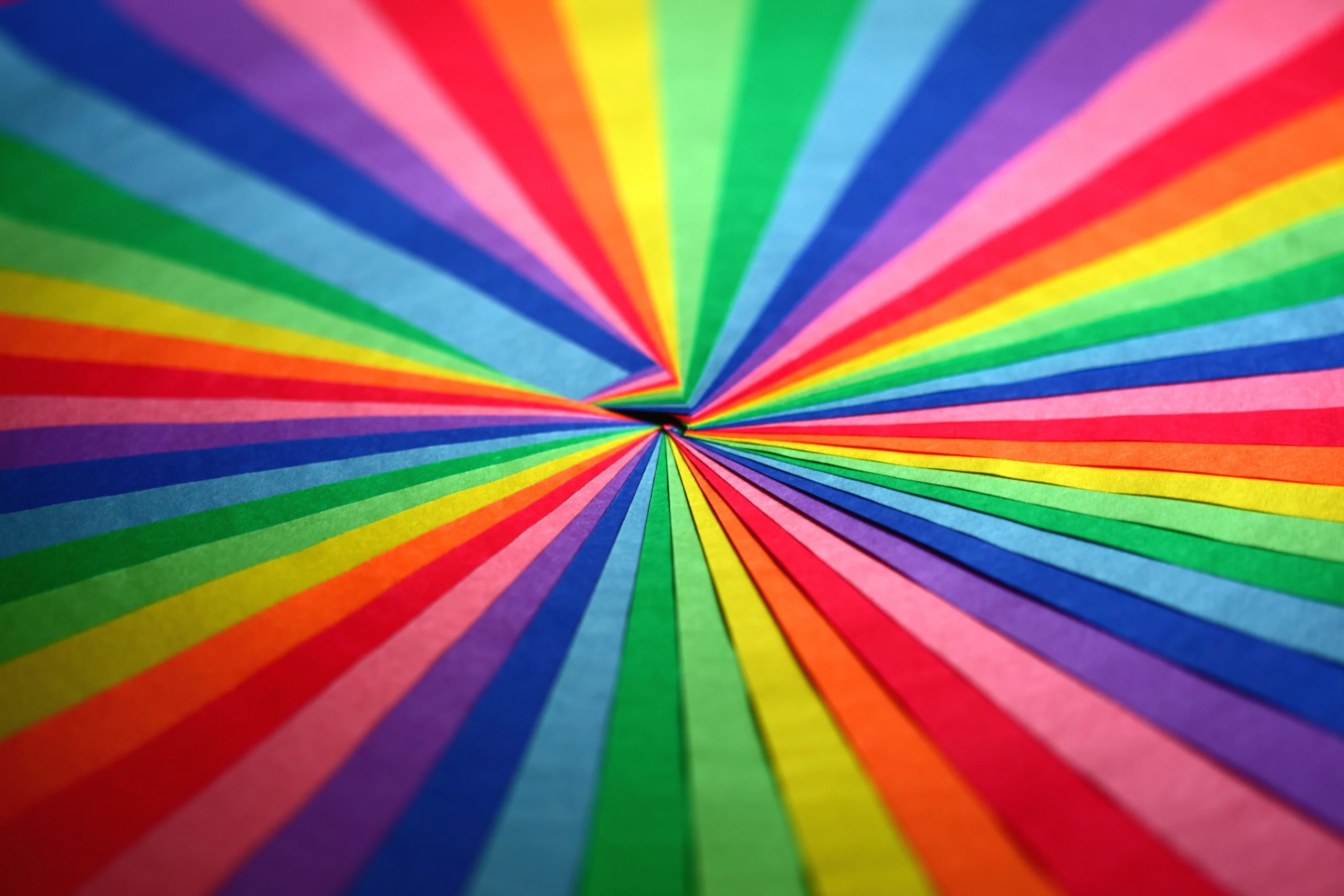 Explosive display of vibrant colored paper forming a symmetrical pattern. jigsaw puzzle