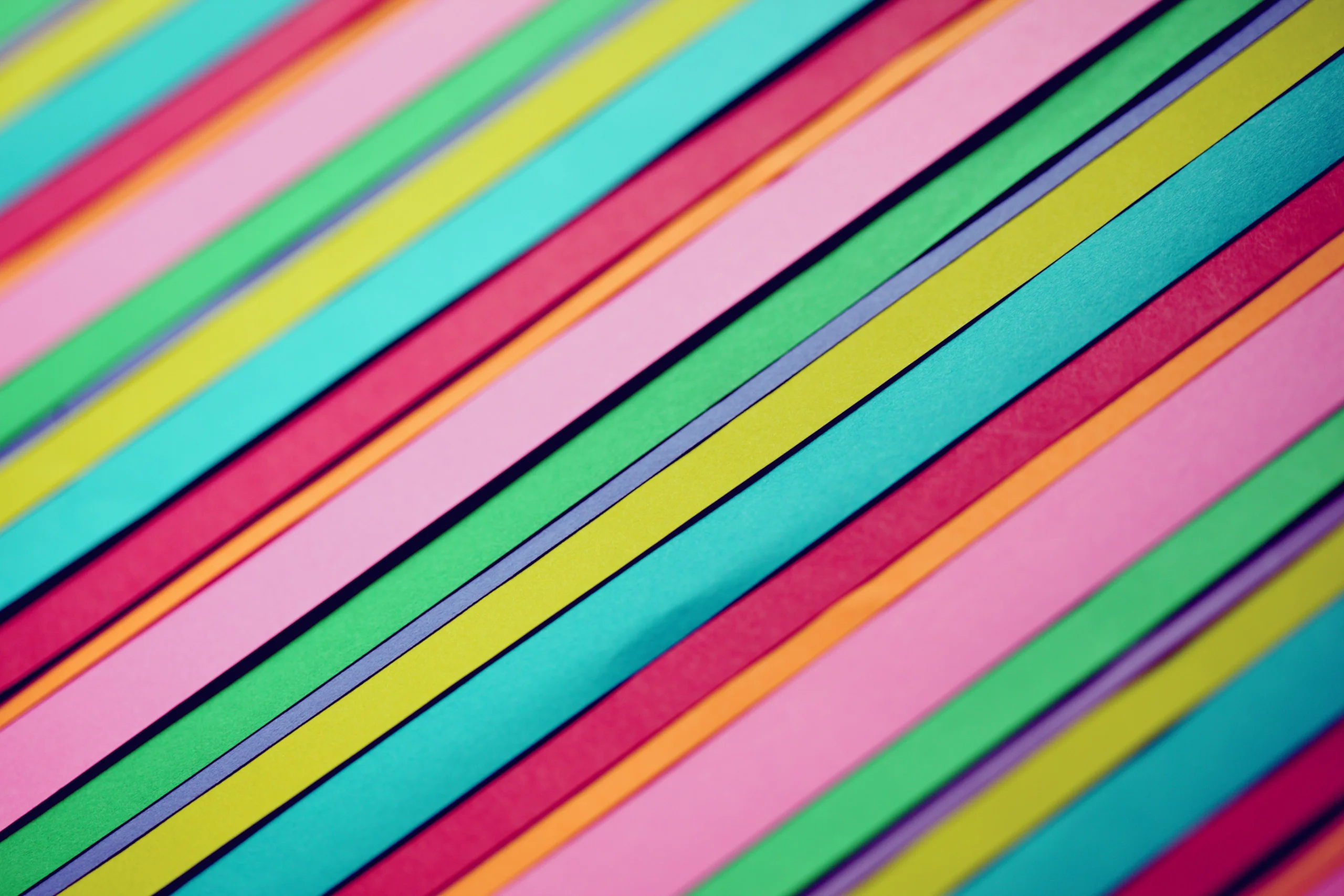 Bright and colorful abstract pattern of diagonal striped papers in various colors. jigsaw puzzle