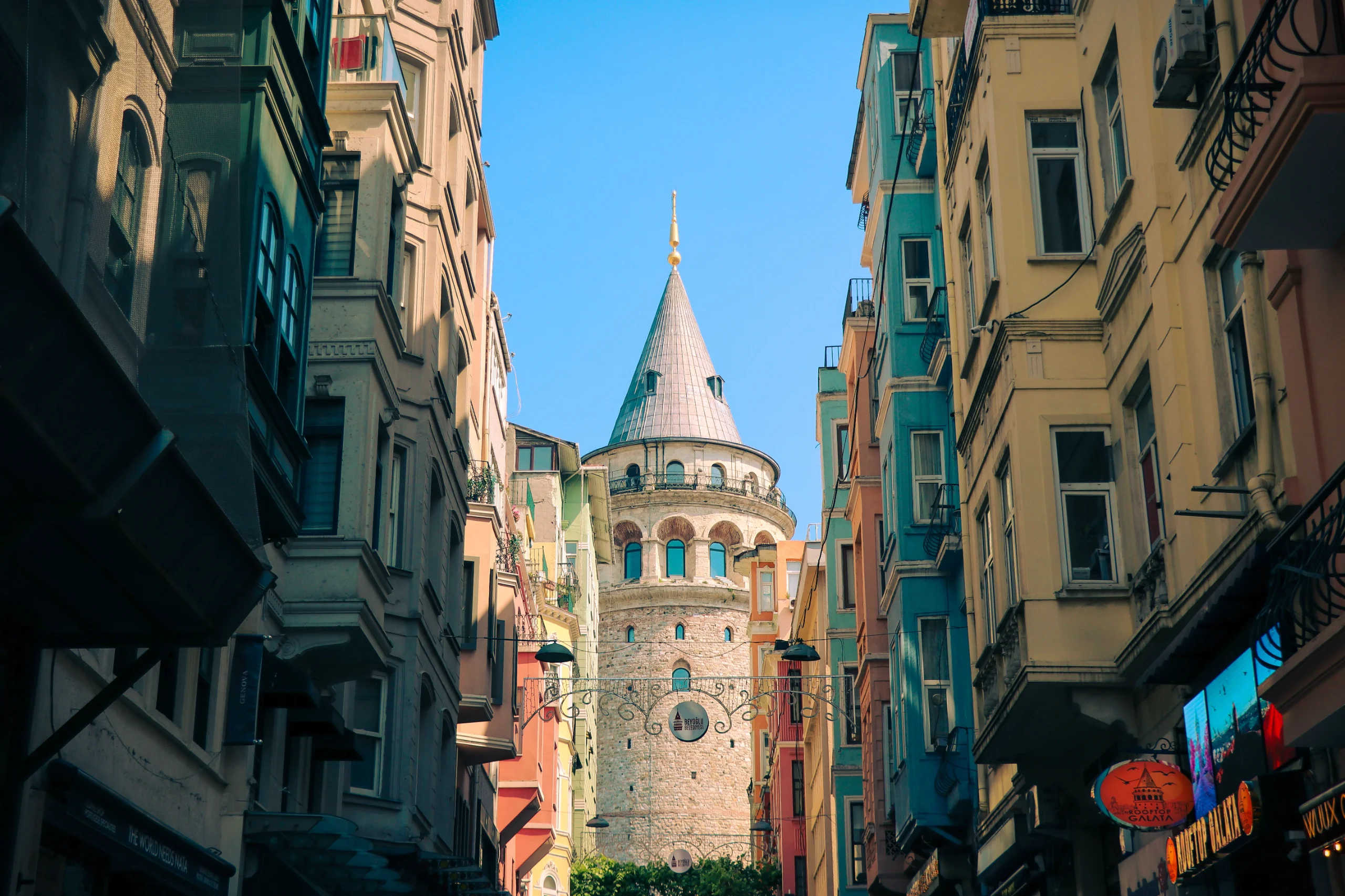Stunning view of Istanbul's Galata Tower framed by colorful buildings, capturing urban charm. jigsaw puzzle