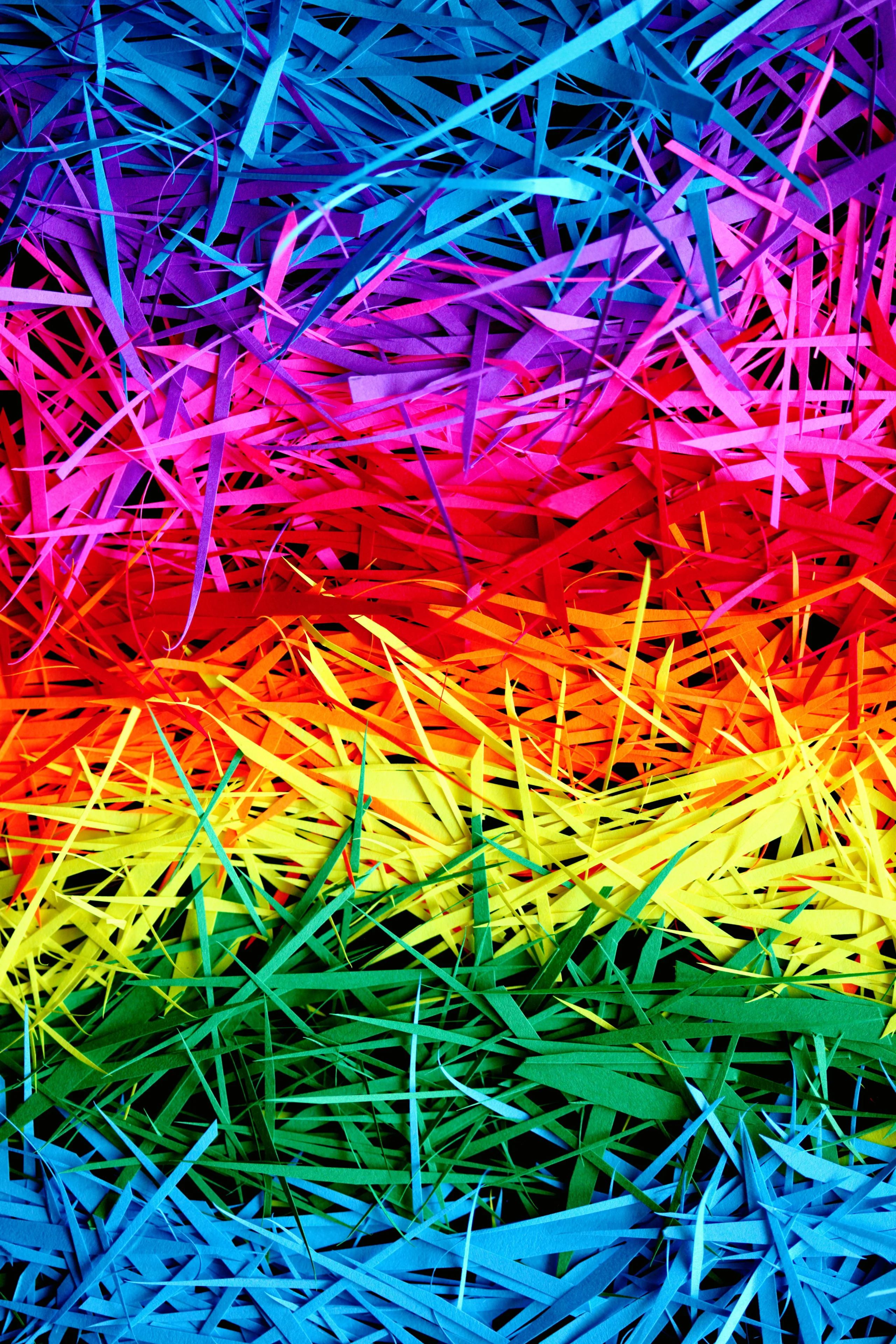 Colorful shredded paper arranged in a vibrant rainbow pattern, showcasing a dynamic and abstract vis jigsaw puzzle