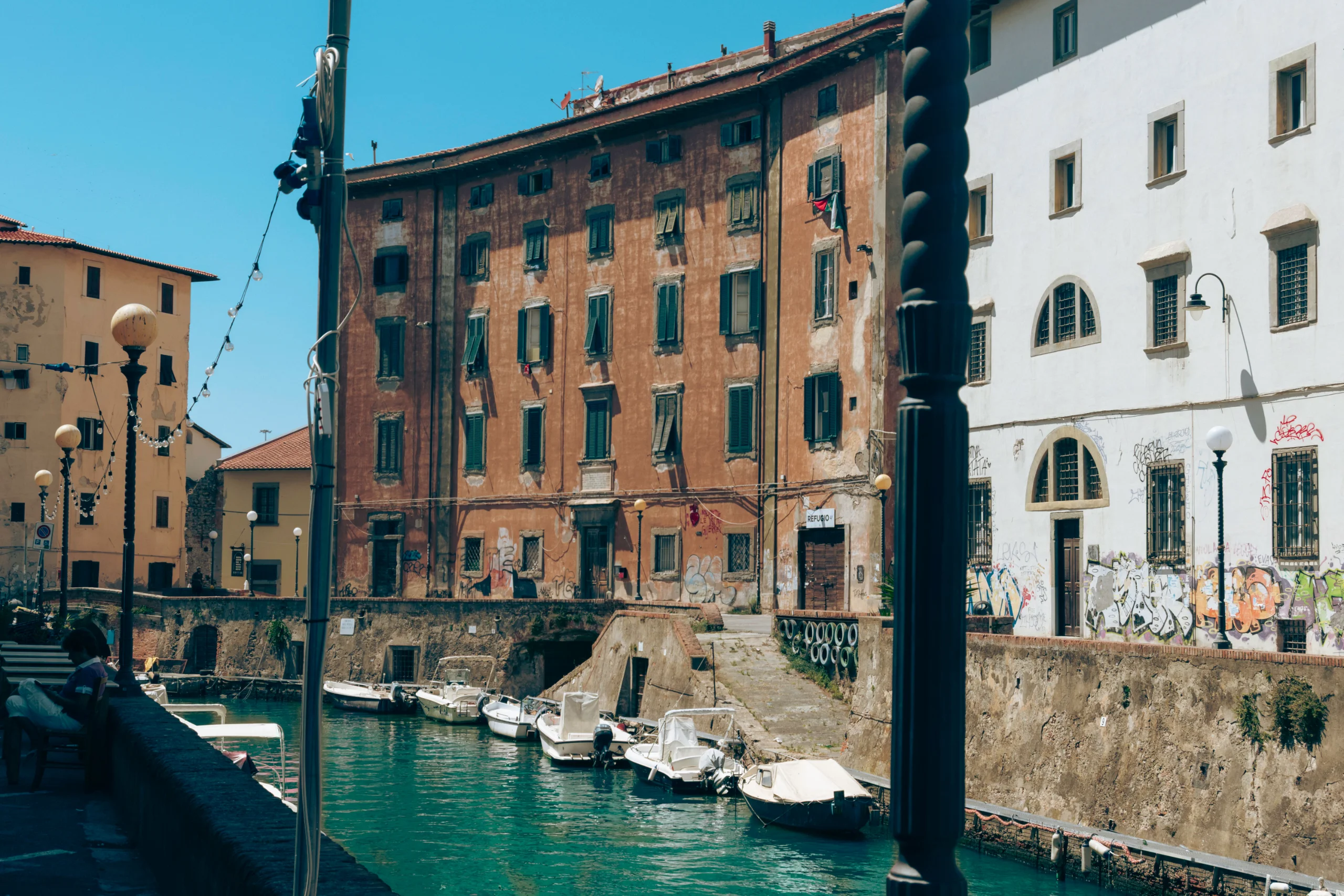 Explore the serene canals of Livorno, Tuscany, surrounded by historic buildings and a tranquil marin jigsaw puzzle